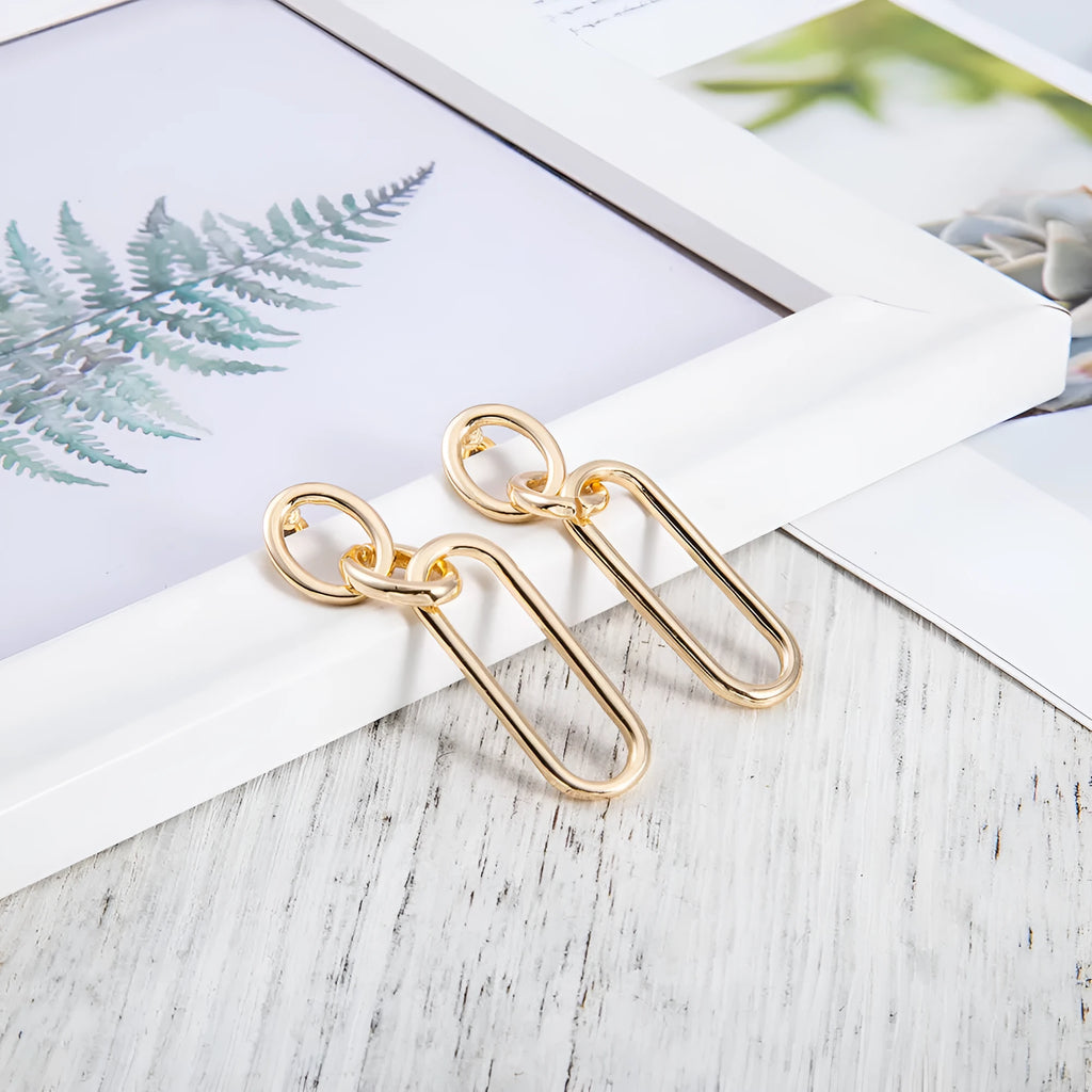 Sterling silver geometric hoop earrings with ring and line detailing