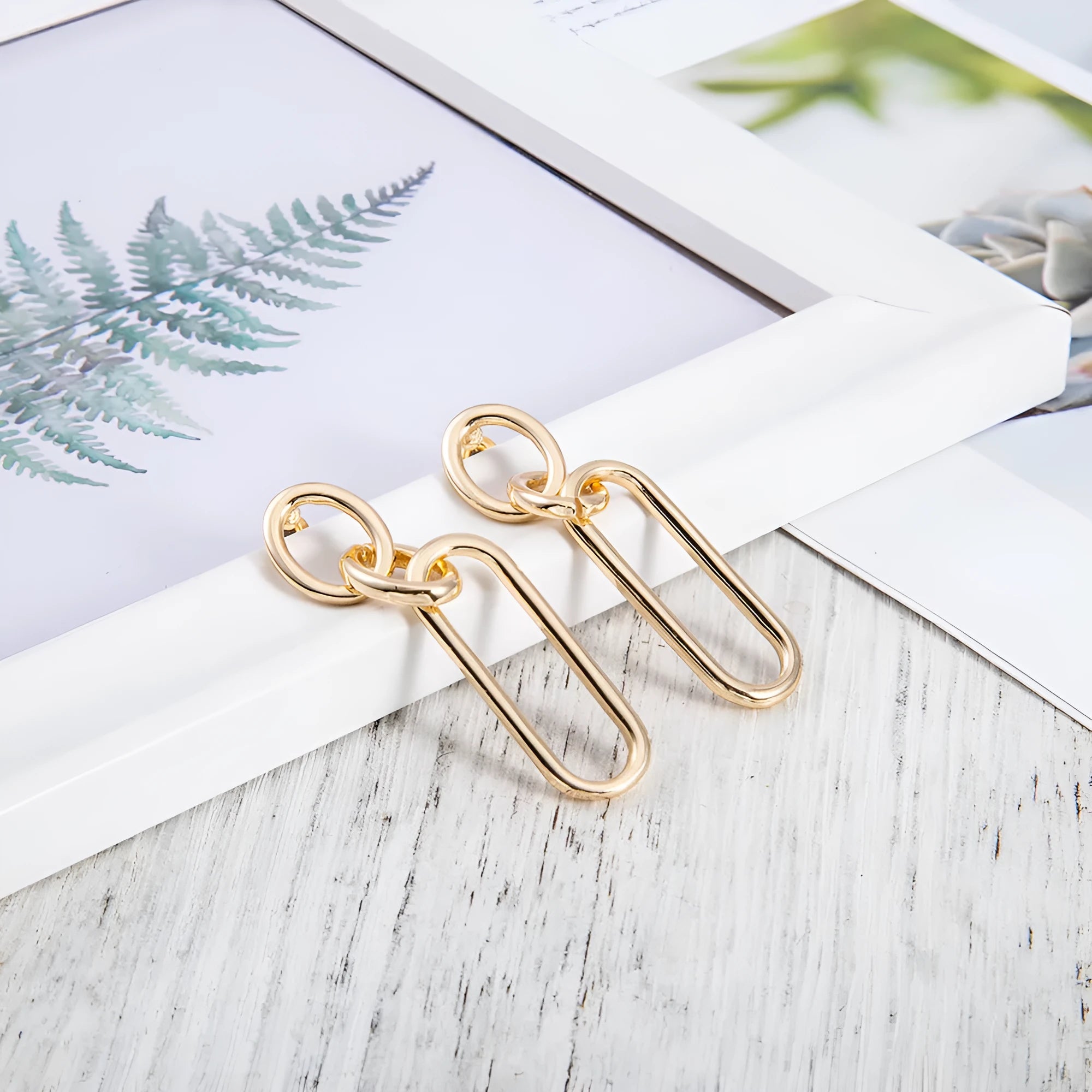 Sterling silver geometric hoop earrings with ring and line detailing