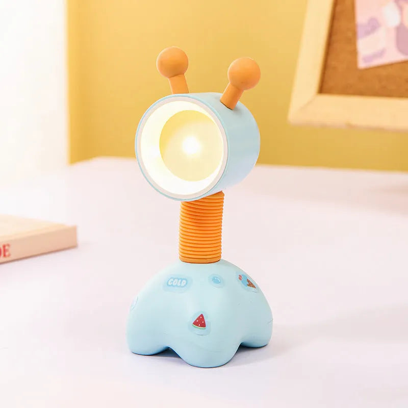 DIY cartoon magnetic small night lamp in assorted animal styles and colours on a desktop.