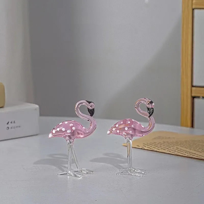 Pink crystal flamingo decorative sculpture on a table, modern simple style.