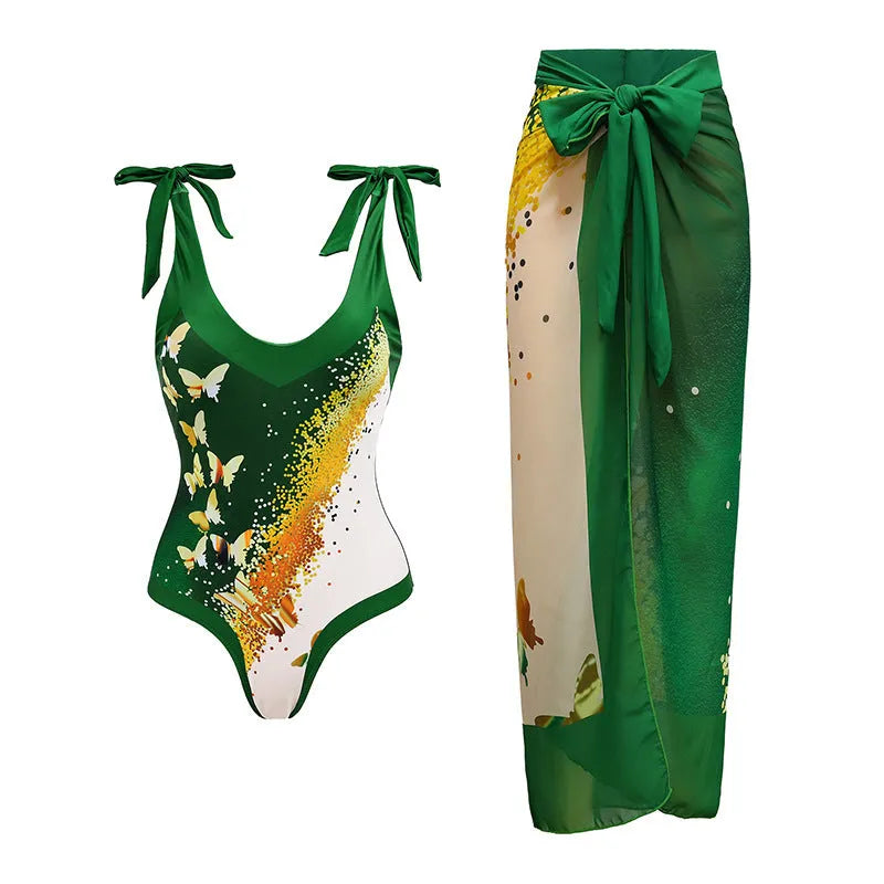 Women's solid colour one-piece swimsuit with spaghetti straps and a matching skirt laid flat.