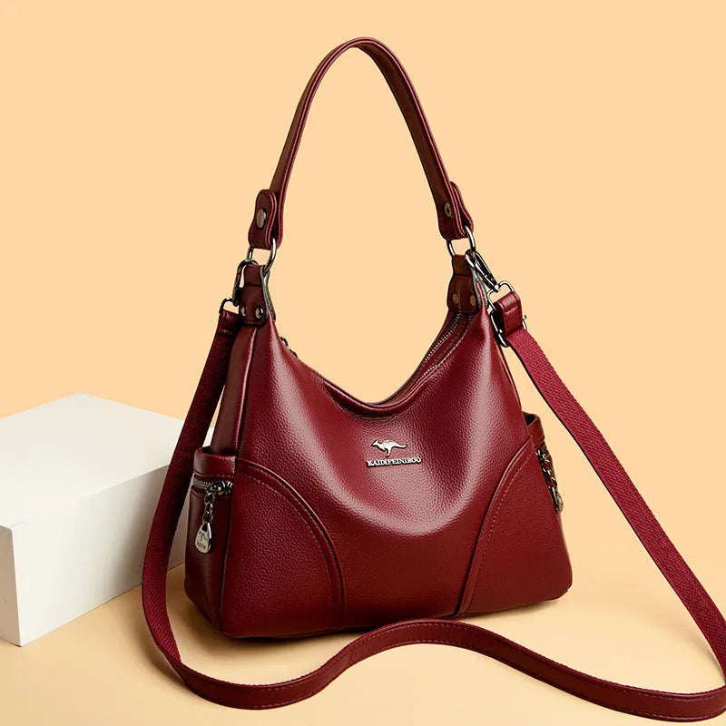 Women's soft PU leather messenger bag in beige with horizontal square shape and lined interior