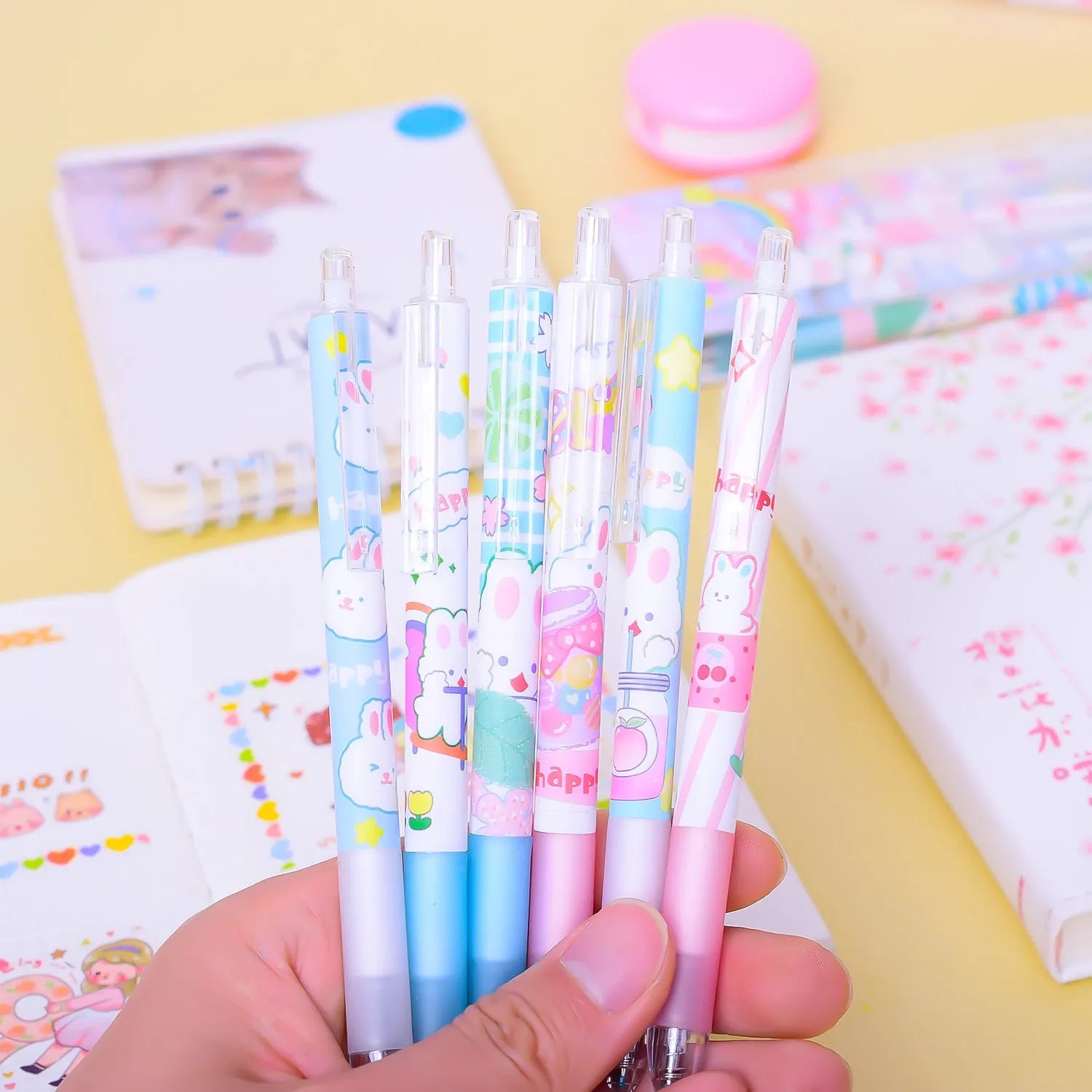 Six black plastic pens with 0.5mm tips and a cartoon bunny design.