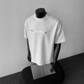 Men's white cotton short sleeve T-shirt with black letter pattern design, loose fit pullover style