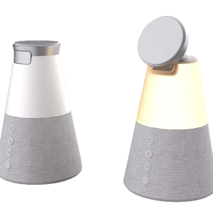 Grey 3-in-1 magnetic wireless charging Bluetooth speaker night light on a tabletop