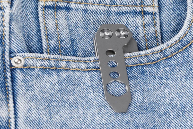 Titanium alloy multi-function crowbar tool with integrated bottle opener in gun grey or stone wash finish.