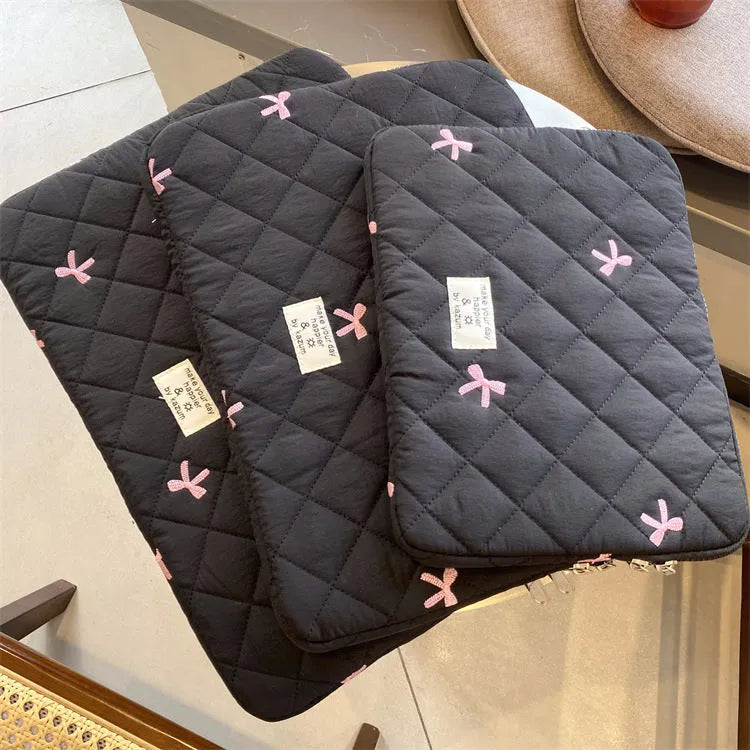 Rhombus embroidered bow design on nylon laptop storage bag showing colour and size options