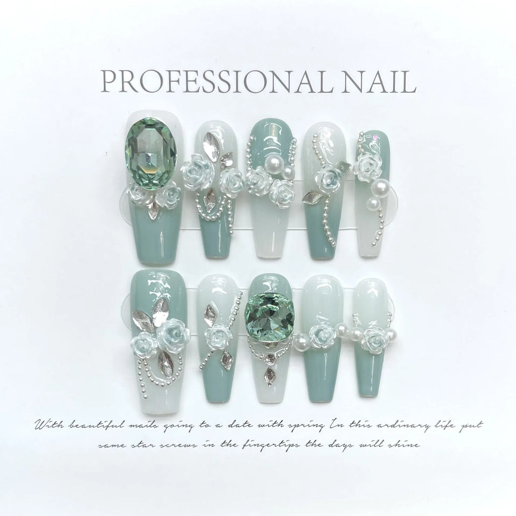 Armour green camellia gradient chain false nails with diamonds, bows and butterflies.