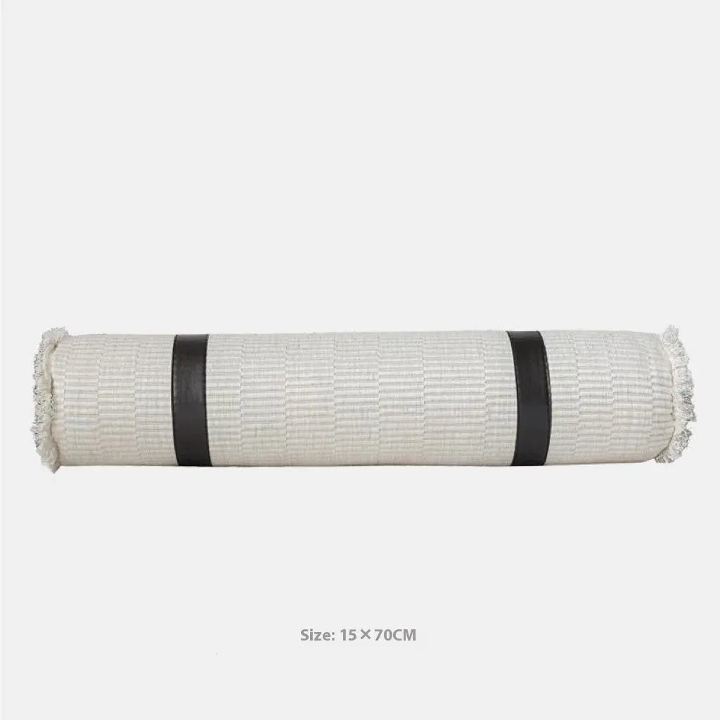 Modern minimalist grey and white plaid bed runner set with pillowcase and round leather pillow on bed