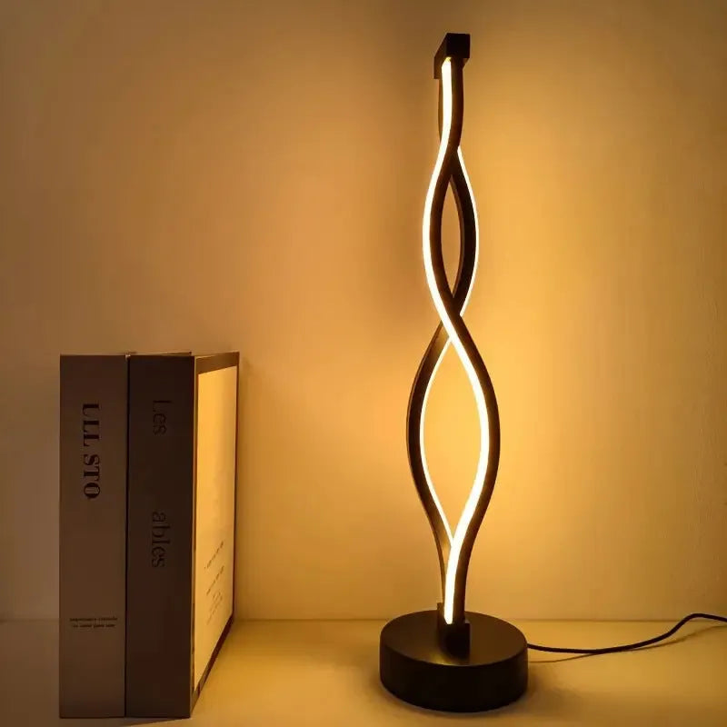 Black aluminium desk lamp with touch dimming buttons showing blue and pink controls