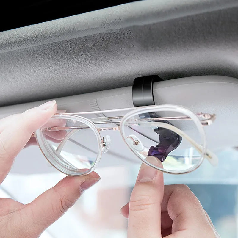 Black plastic clip for mounting sunglasses and cards on a car sun visor