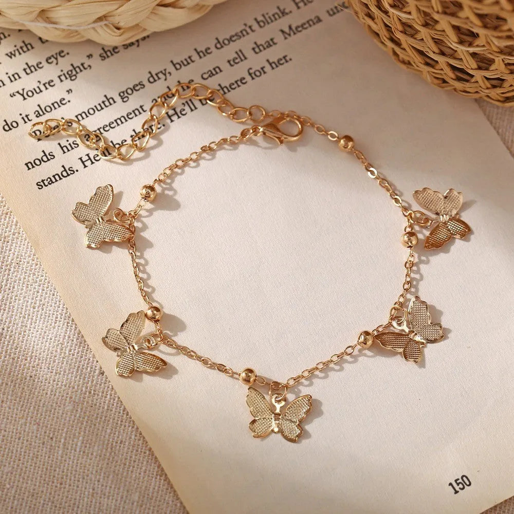 Alloy butterfly anklet for women in gold finish on ankle, hollow design beach foot ornament