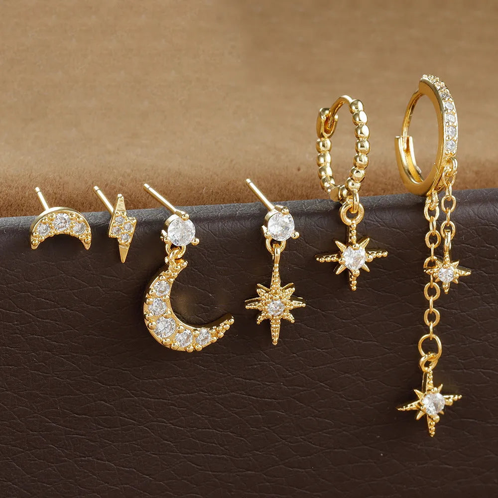Six gold-colour chain tassel earrings with zircon detail arranged as a complete set