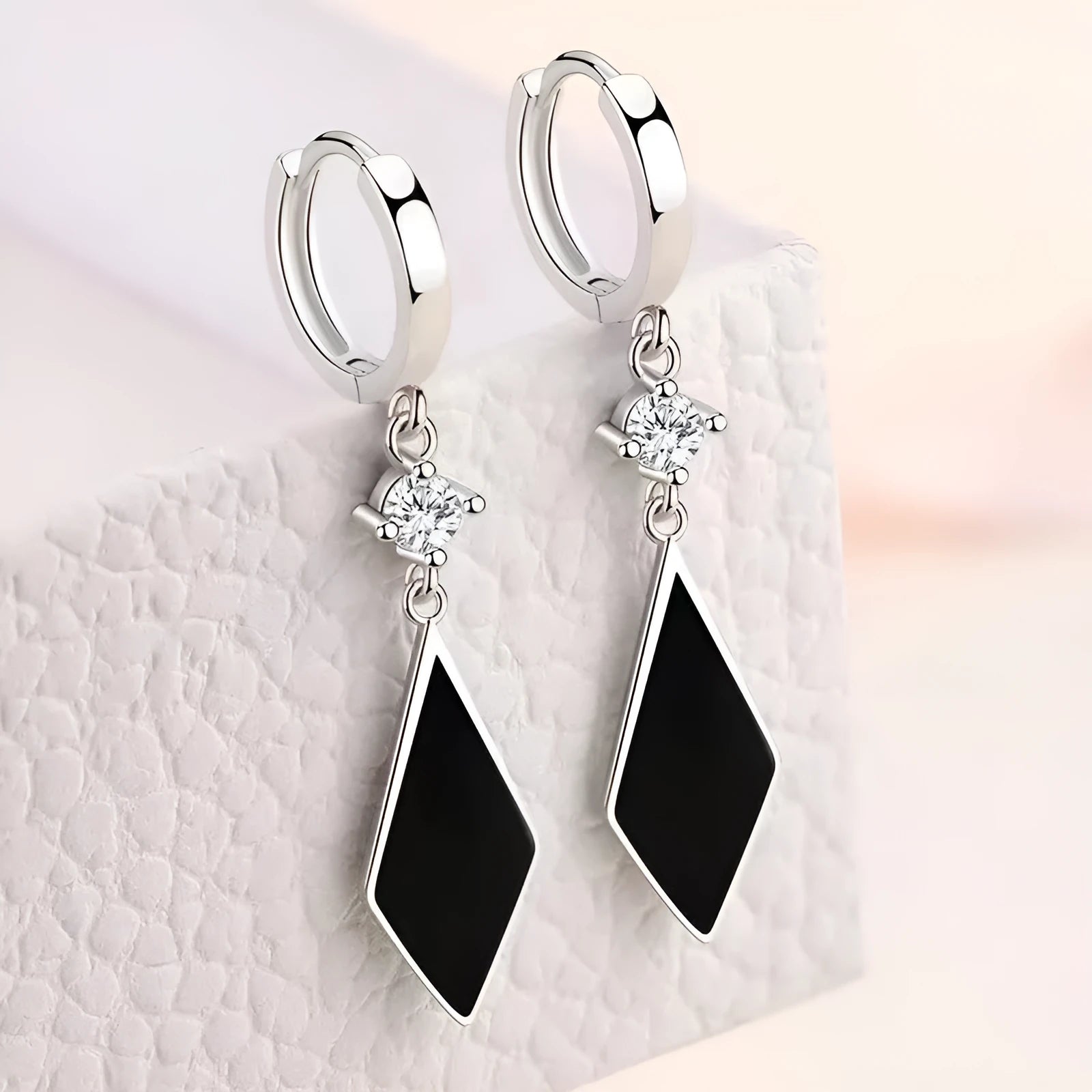 Silver geometric diamond shape drop earrings with ear clip fastenings