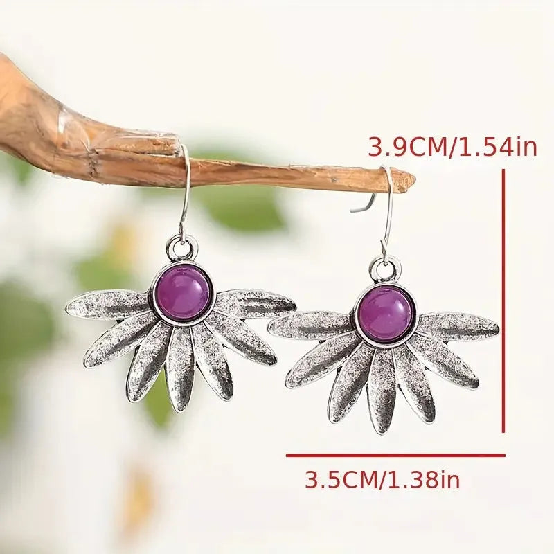 Purple Bohemian style drop earrings with resin gemstone accents and animal zodiac design on alloy framework