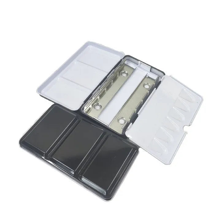 Tinplate metal watercolour paint box for solid pigments in three folding sizes.