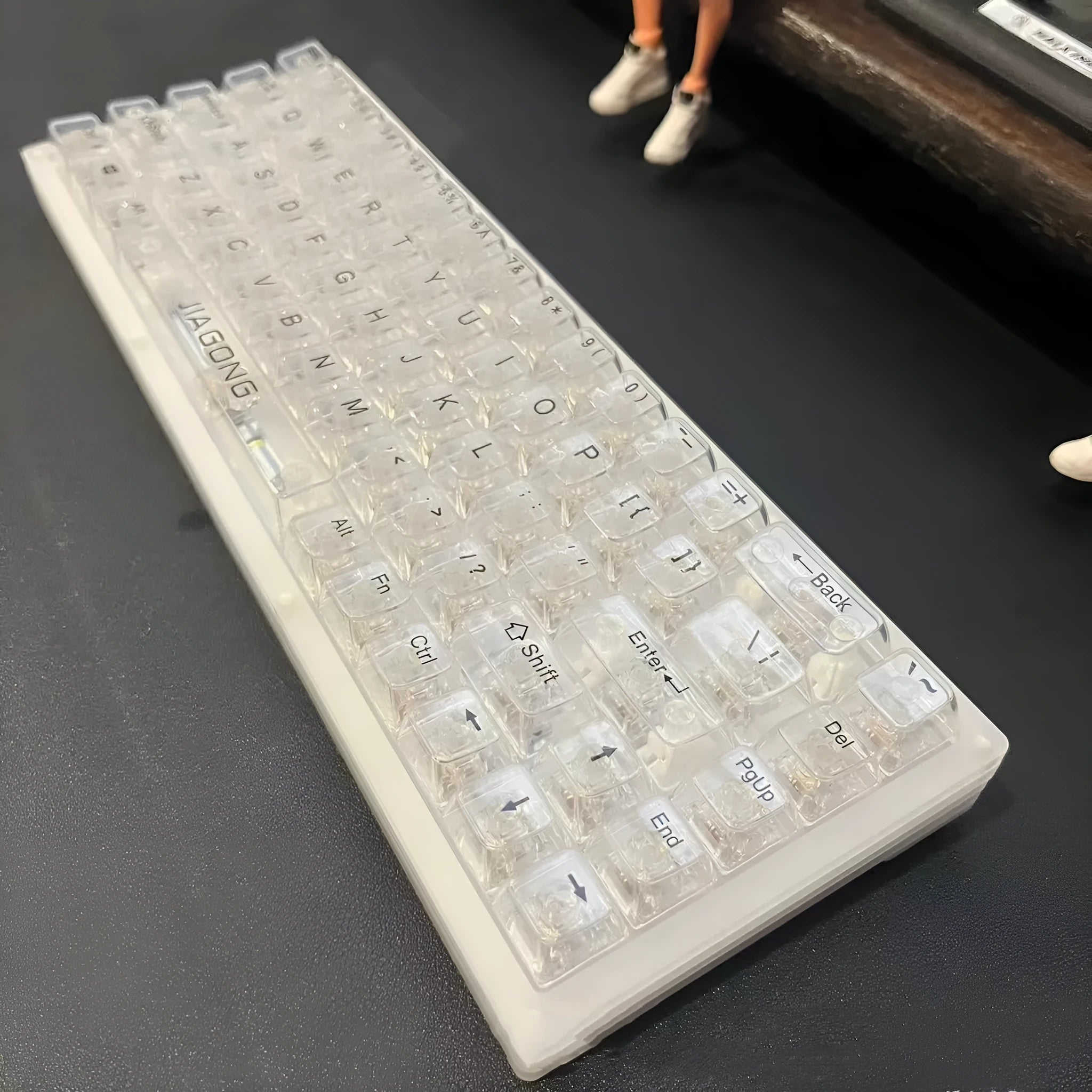 Transparent 132-key mechanical keyboard key cap set showing clear plastic construction