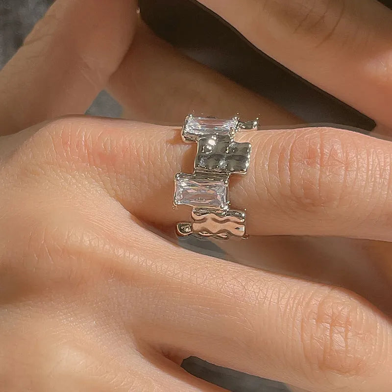 Silver geometric cross ring with zircon detailing and open pastoral retro design
