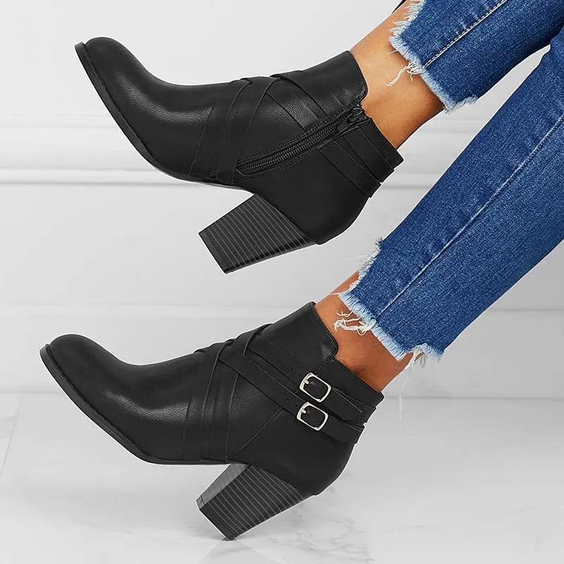 Women's black PU leather ankle boot with side zipper and 7cm heel on a rubber sole