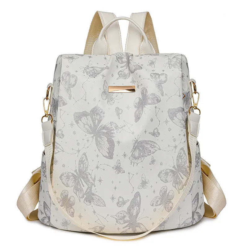 Butterfly print PU backpack on a physiological curve backplate, shown in khaki colour.