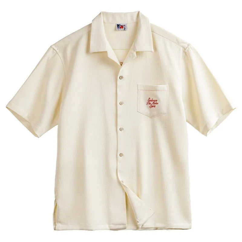 Light apricot men's shirt with bamboo floral pattern and Cuban collar on hanger
