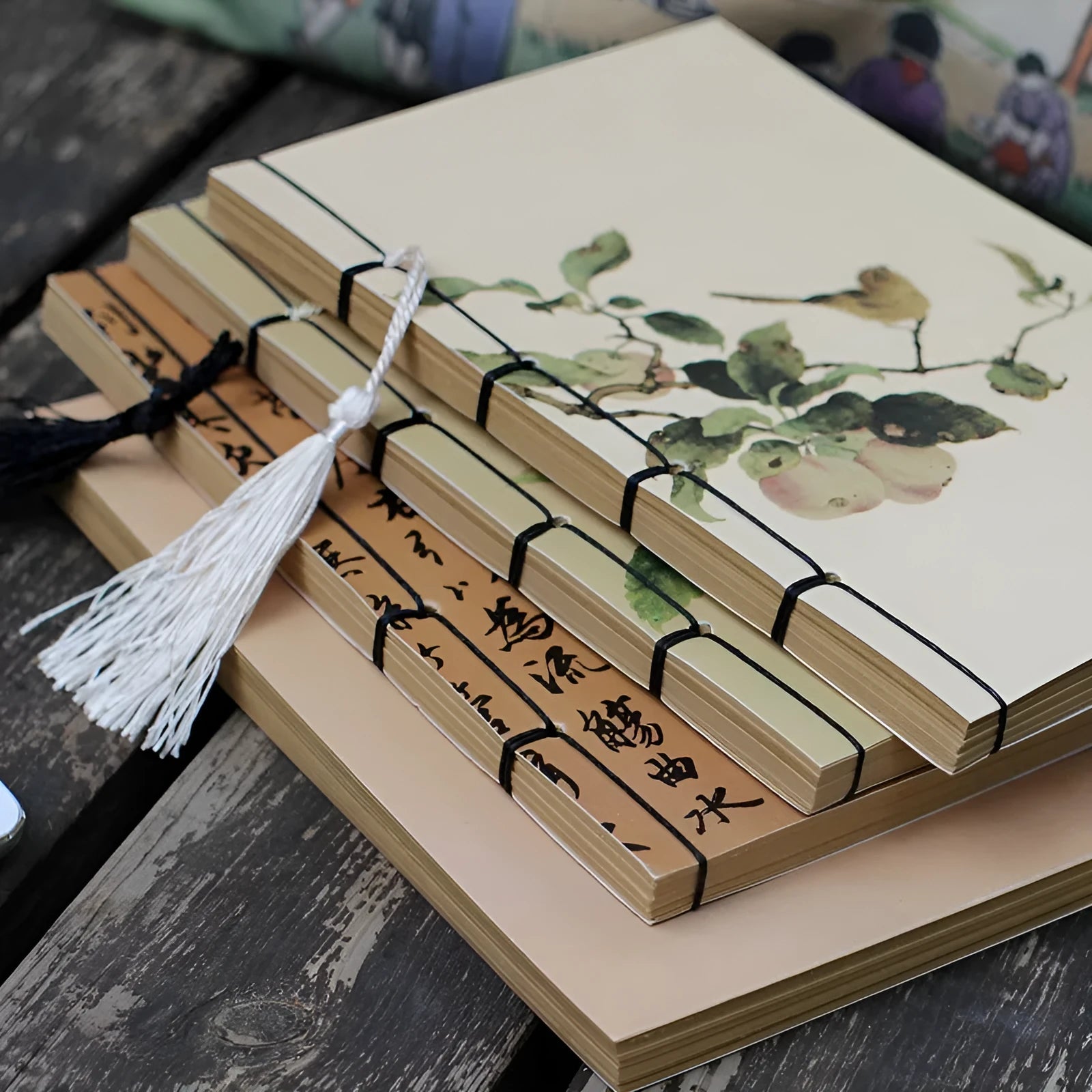 A5 antique thread-bound notebook with embossed cover and decorative tassels