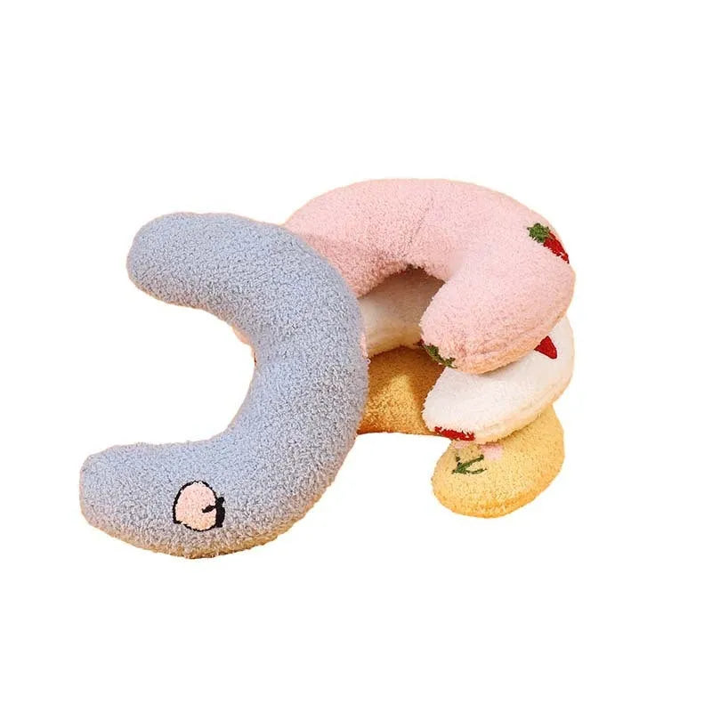 Half moon U-shaped cloth pillow for cats in blue, pink, white, and yellow colour options.