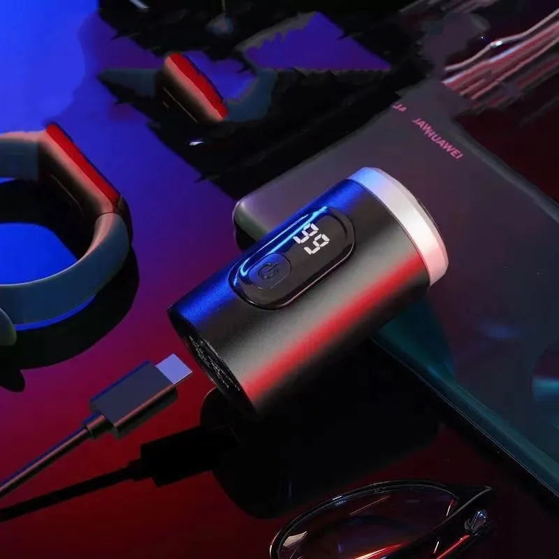 Black portable rechargeable shaver with USB charging cable and cleaning accessories