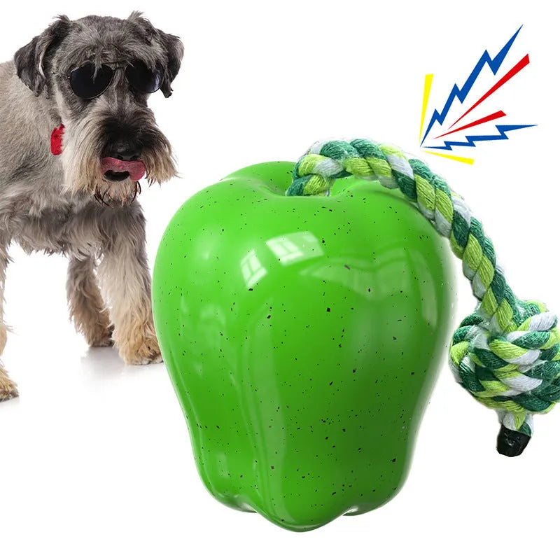 Green plastic apple-shaped dog toy with molar texture, acting as a food-dispensing ball and chew.