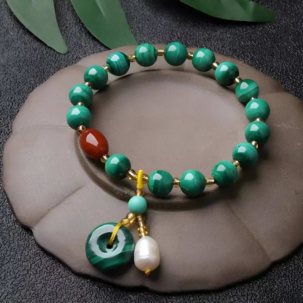 Natural malachite and red agate bracelet with 7-8mm barrel beads on wrist