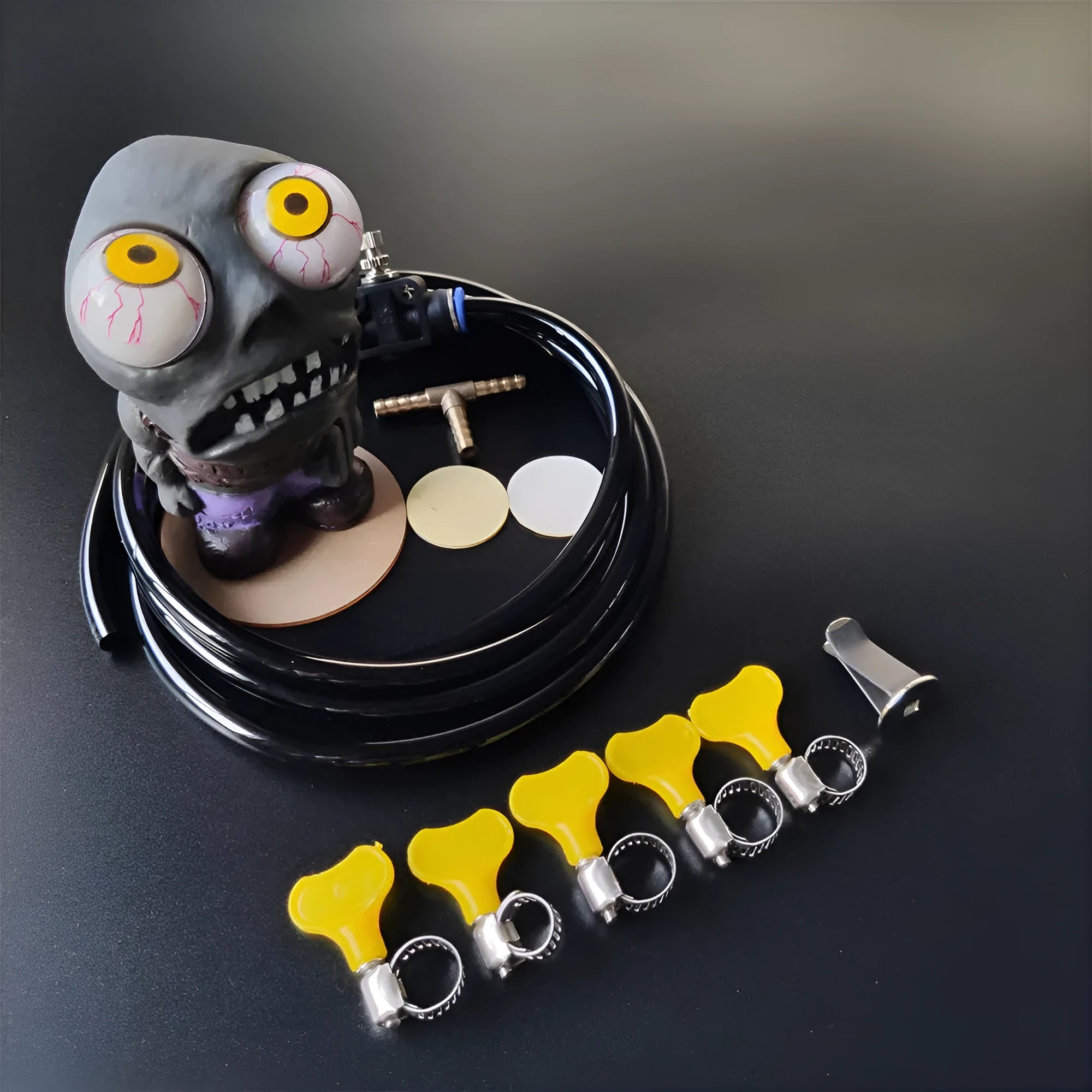 Turbo car blow-off valve accessory kit with explosive eye zombie doll and pressure regulating valve components.