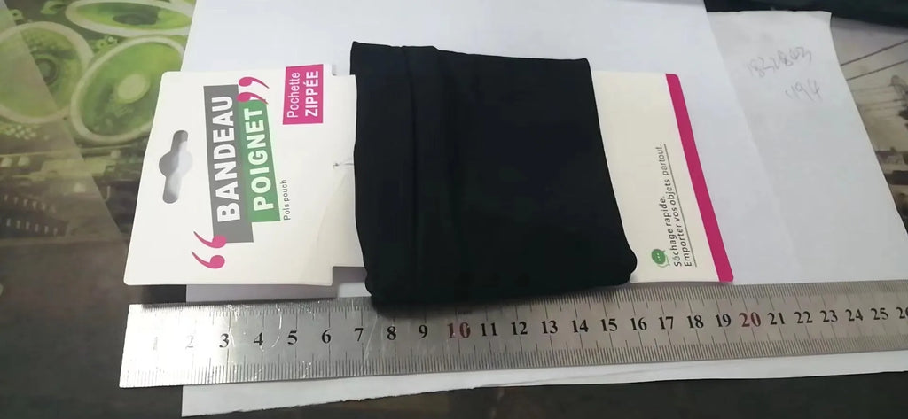 Black wrist bag armband sleeve for mobile phone, shown on an arm, dimensions 10cm by 10.5cm.