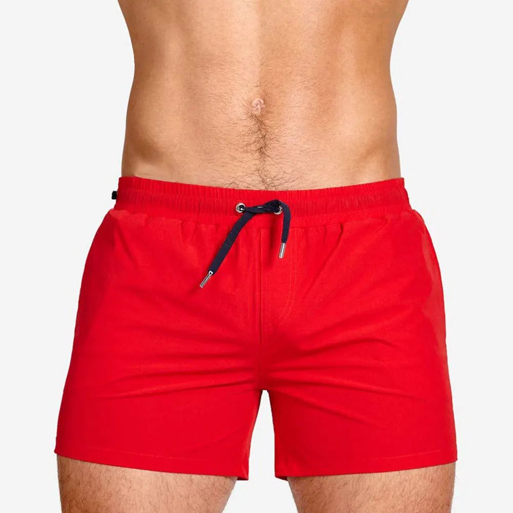 Solid colour sports shorts with mesh lining in Army Green, shown flat.