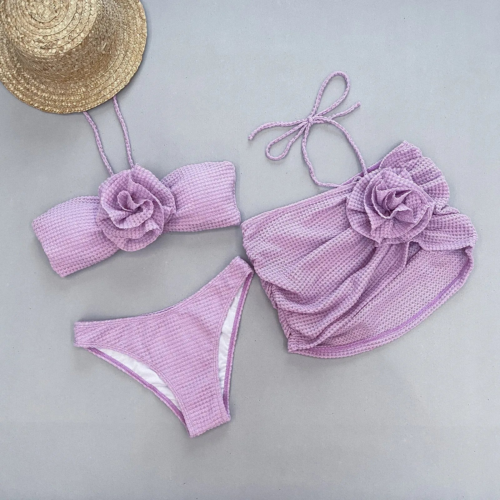 Women's purple and white three-piece bikini swimsuit with 3D flower split design