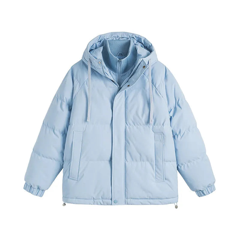 Loose-fitting solid-colour winter cotton-padded jacket with side pockets, shown on a hanger.