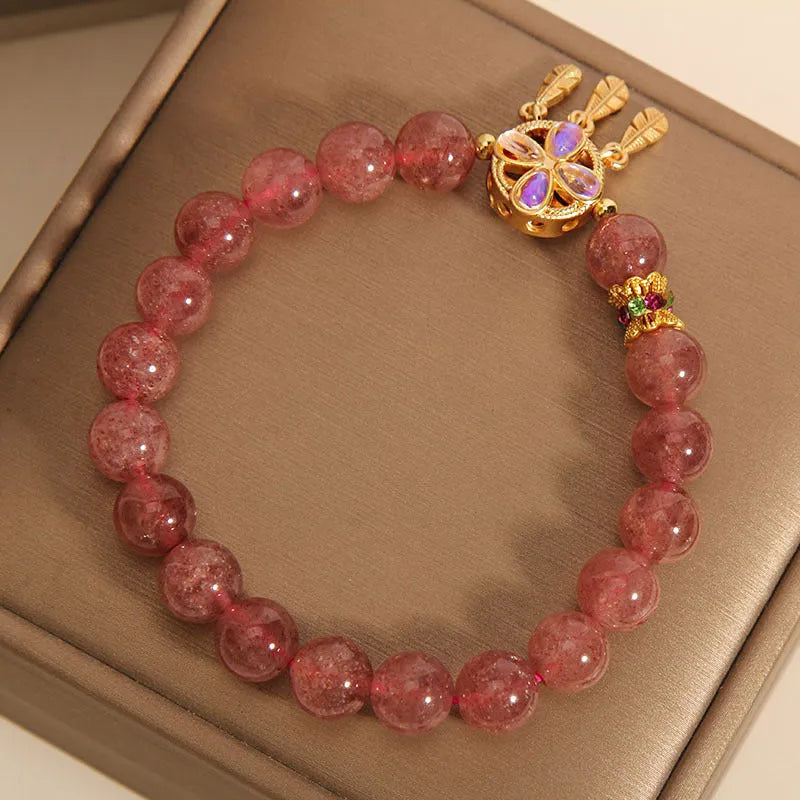 Women's strawberry quartz bracelet with four-leaf clover dream catcher ball pendant on adjustable leather cord