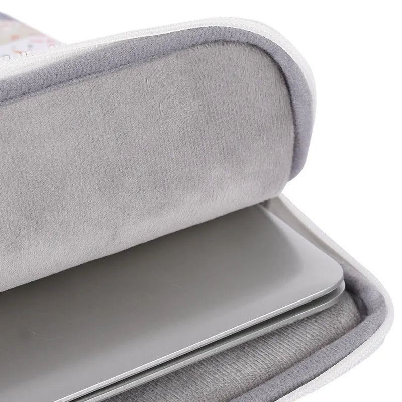 White PU leather waterproof laptop inner sleeve for 14 inch computers on a table.