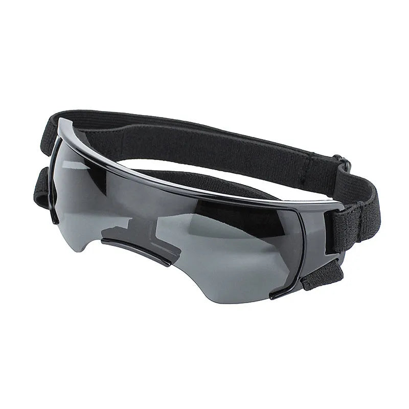 Dog UV-proof goggles with PC lens and adjustable nylon strap in black colour on a plain background