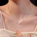Women's silver heart necklace with minimalist refined grace design on copper pendant