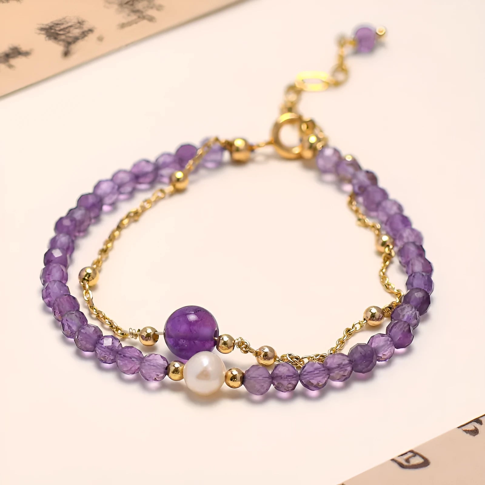 Women's amethyst bracelet with electroplated crystal stones in a diamond Chinese pattern.