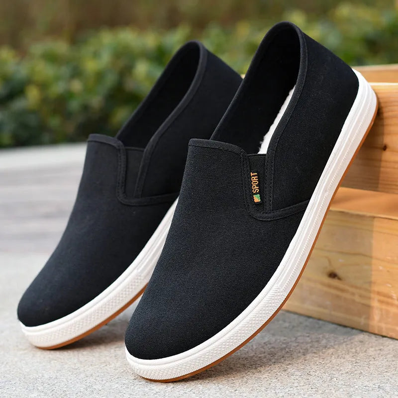 Men's low-top canvas slip-on cloth shoes in black or blue with round toe and composite sole