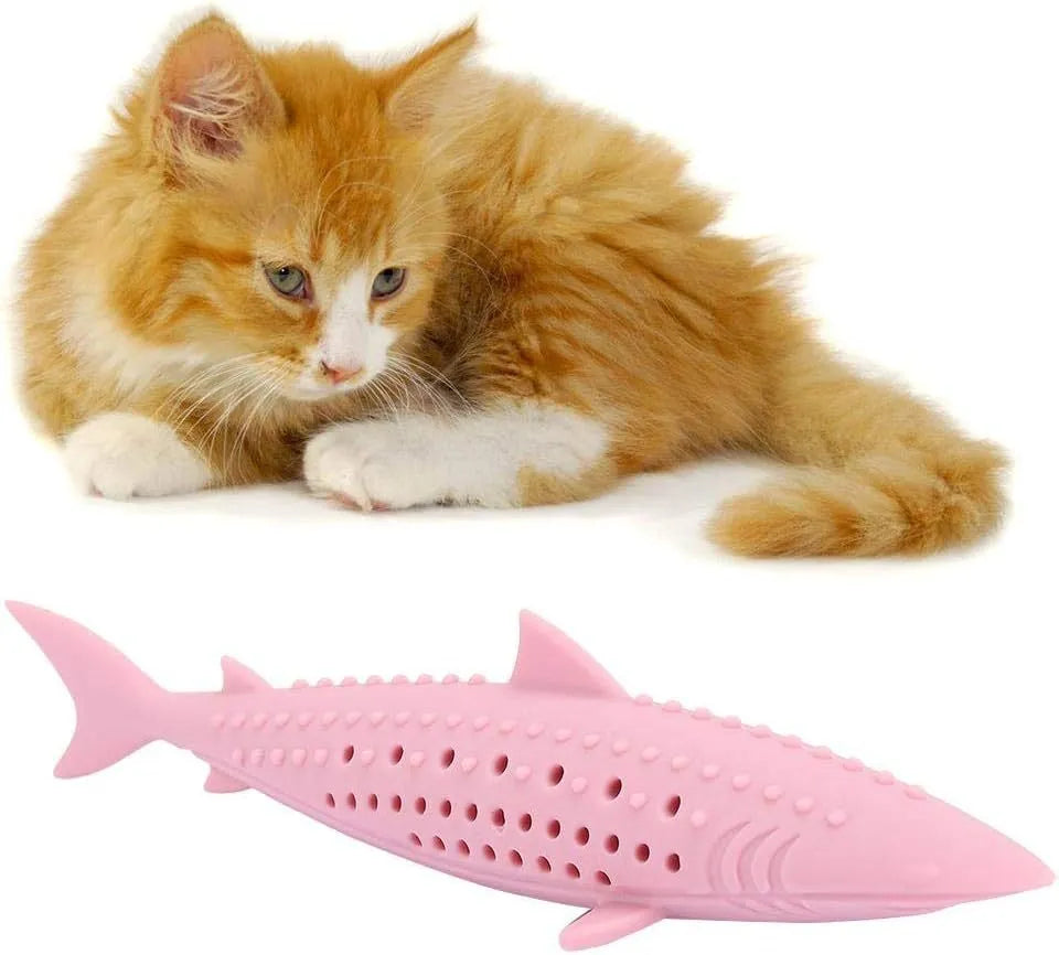 Green silicone fish-shaped cat chew toy with side holes on a white background.