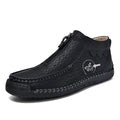 Men's black slip-on leather loafers with a round toe and rubber sole on a plain background.