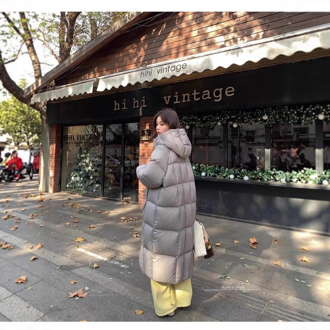 Women's mid-length loose padded puffer coat in beige with white duck down filler and pocket