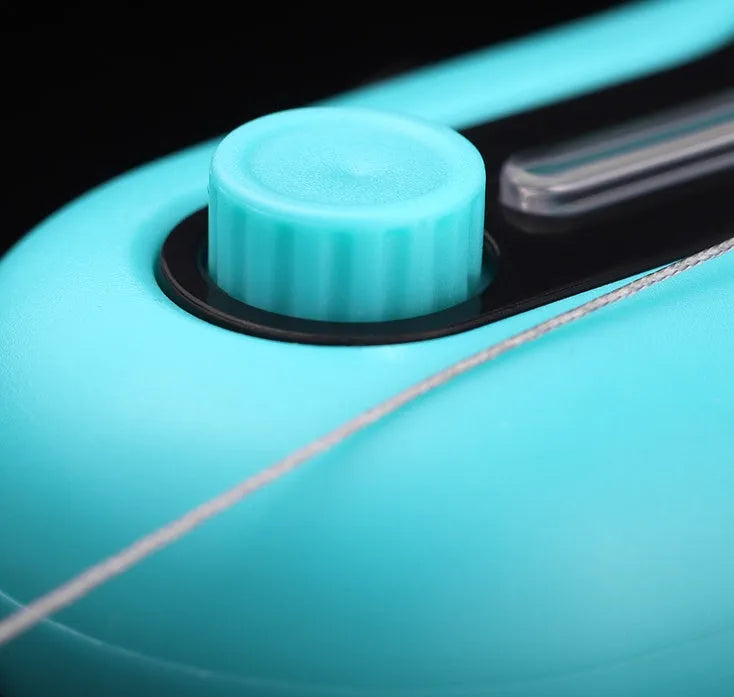 Blue electronic fishing bite alarm with LED light and buzzer attached to a fishing rod