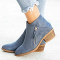 Women's beige suede ankle boots with a side zip and chunky heel on a white background.