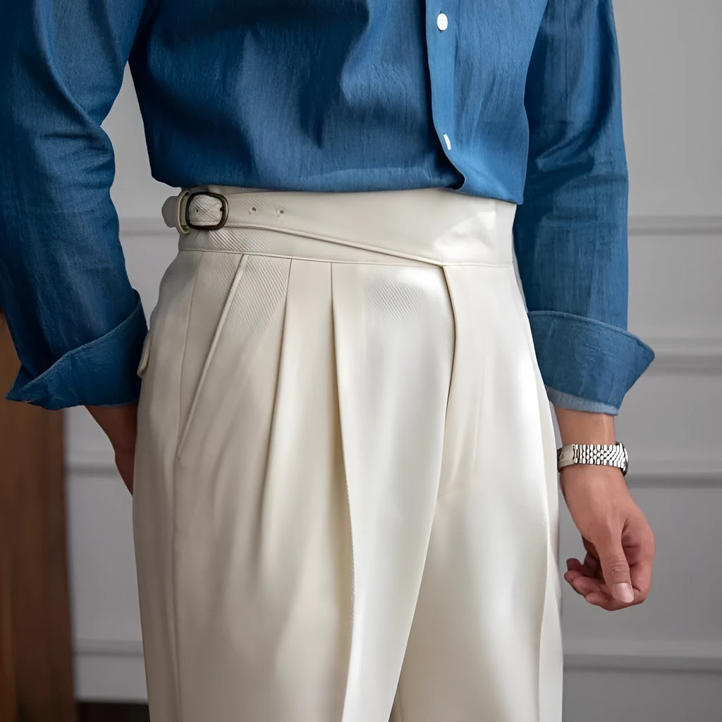 Man wearing black high waist straight leg casual trousers made from polyester fabric.