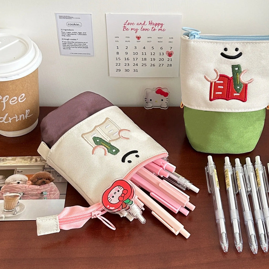 Brown collapsible pencil case with cartoon design measuring 17x14cm