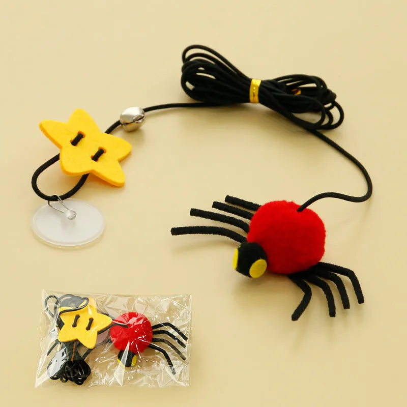 Cat hanging door toy with elastic rope featuring feather, bell and spider attachments in red or yellow colours