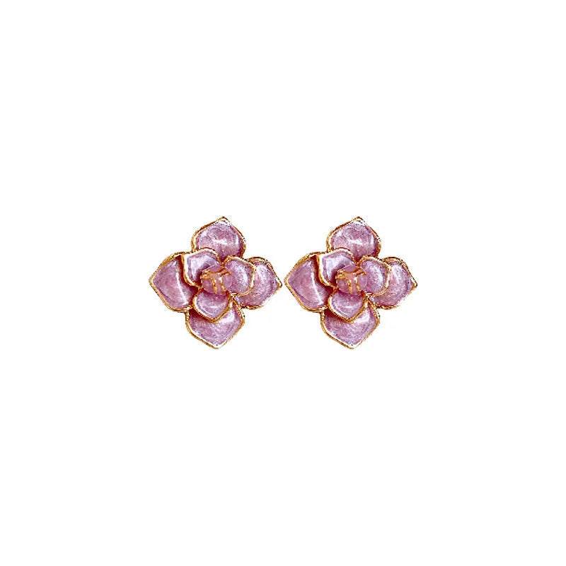 Gold plated flower stud earrings with a purple oil-spot glaze finish on copper.